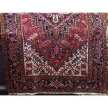 Persian carpet with good tight weave decoration with central medallion and scroll decoration, upon a