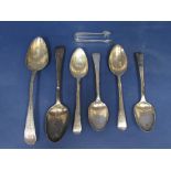 A collection of antique silver spoons to include a Georgian bright cut tablespoon and five others