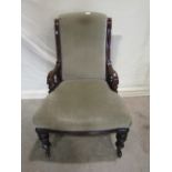 A Victorian drawing room chair with upholstered seat, and shaped back within a mahogany showwood