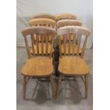 A set of six contemporary Windsor lathe back kitchen chairs, with splayed turned supports and