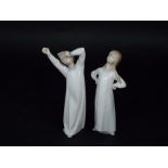 A pair of Lladro figures of children in night dresses