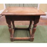 An Old English oak joint stool with pegged frame on turned supports