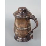 Good George III silver lidded baluster tankard, with embossed band, pierced thumb piece and S scroll