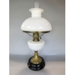 A good late 19th century brass and opaline glass oil lamp with opaline glass shade and reservoir,