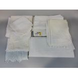 Box of mixed white table and bed linen, including cloths with crochet borders and pulled threadwork,