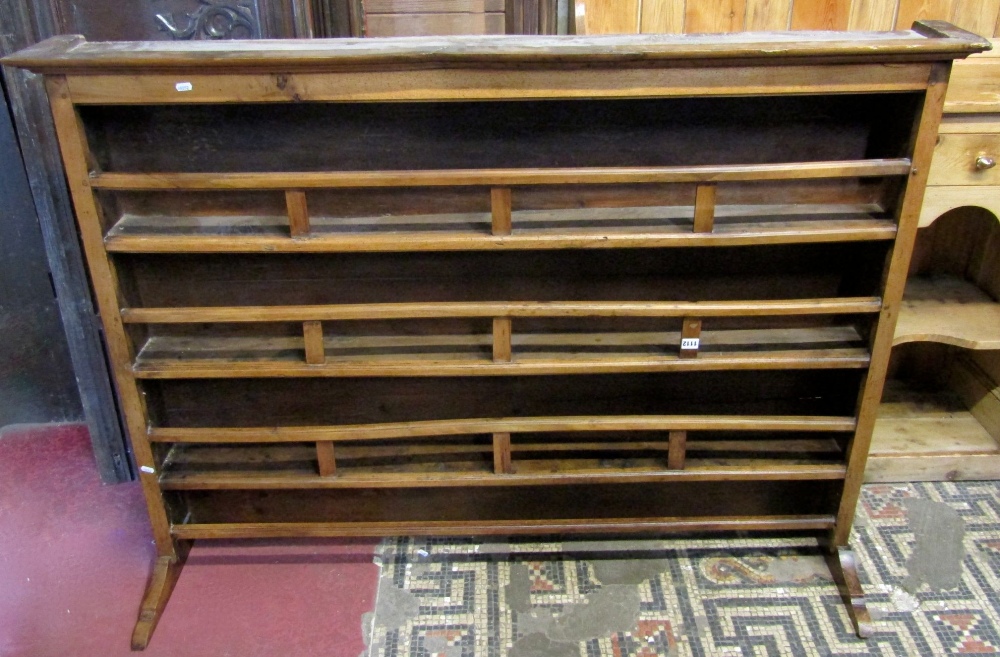 A 19th century French provincial fruitwood dresser plate rack, with three fixed open shelves with