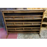 A 19th century French provincial fruitwood dresser plate rack, with three fixed open shelves with