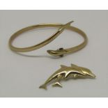 9ct novelty dolphin jewellery comprising a bangle and brooch, 6g total (2)