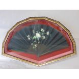 Cased and glazed 19th century French brize fan hand painted with a floral bouquet on a black