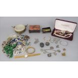 Collection of silver items comprising a bracelet hung with six medallions, planished bangle, four
