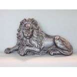 Large cast iron study of a recumbent lion, 65cm long