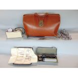 Vintage stitched leather Gladstone bag, fitted with various medical instruments