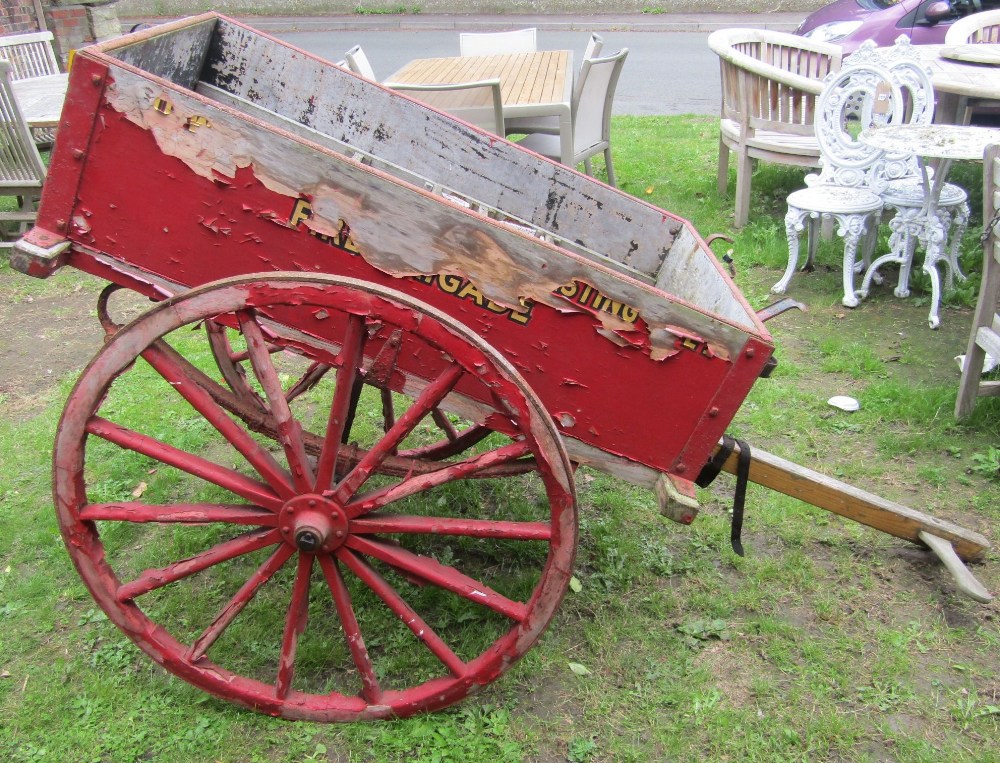 A vintage wooden hand cart with iron fittings, two spoke wheels with iron rims and red painted - Image 3 of 4