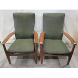 A pair of Parker Knoll open armchairs with traditional sprung seats, upholstered backs and seat