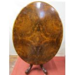 A good quality Victorian walnut and well figured walnut loo table, the oval top raised on turned