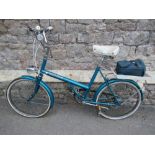 A vintage Raleigh Shopper ladies bicycle, three speed, blue metallic frame, sprung Italian Iscaselle