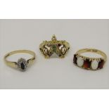 Three 9ct dress rings comprising a multi-stone set example in the form of a clown, a blue spinel and