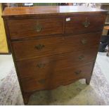 A 19th century mahogany bedroom chest of two short over three long graduated drawers with shaped