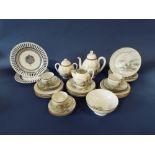 A collection of Japanese eggshell porcelain teawares with painted landscape detail including teapot,
