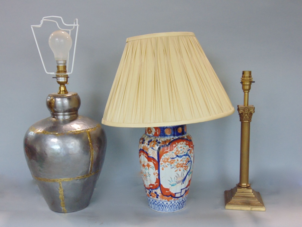 Japanese imari lobed porcelain baluster table lamp, together with a further eastern white metal