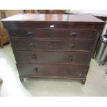 A 19th century oak bedroom chest of two short over three long graduated drawers, partially flanked