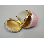 Fine quality silver and guilloche enamel acorn shaped compact, the hinged lid enclosing an