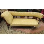 An Edwardian inlaid rosewood chaise longue, with recently reupholstered finish in a pale yellow, the