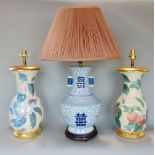 Pair of glass baluster table lamps over a printed Evesham type pattern, 40 cm high together with a