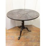 A 19th century mahogany supper table, the circular top for five plates, within a carved floral