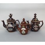 Three 19th century bargeware teapots of usual form with teapot knops and relief moulded