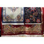 Large Chinese full pile wool carpet with typical pastel decoration upon a red ground 360 x 250 cm;