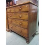 A 19th century mahogany bedroom chest of two short over three long graduated drawers with turned