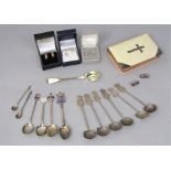Mixed collection of silver items comprising a 19th century mustard spoon, enamelled souvenir spoons,