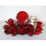 A collection of Villeroy & Boch Granada red glazed wares comprising six dinner plates, tea pot, milk