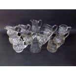 A collection of twelve 19th century and later cut glass jugs to include good quality Irish