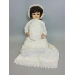 An Armand Marseille bisque head doll mould number 996/10 closing eyes, open mouth in a Victorian