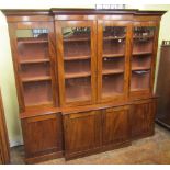 A good quality century mahogany breakfront four door bookcase, the lower section