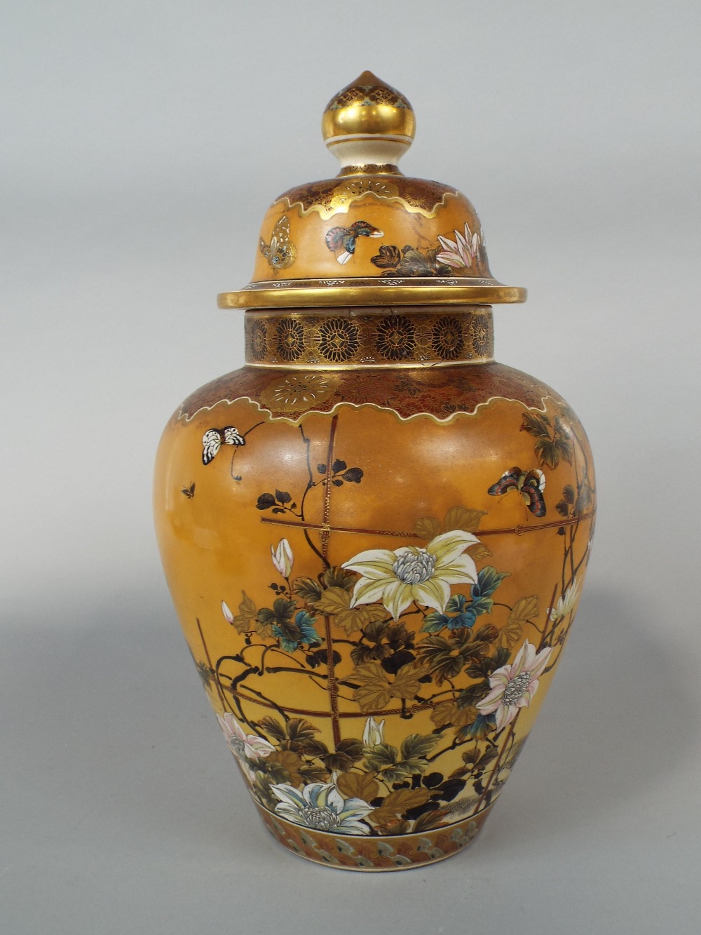 A substantial late 19th century Satsuma type vase and cover with polychrome painted floral and