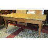 A good quality Victorian style light oak pull out extending dining table of rectangular form, with