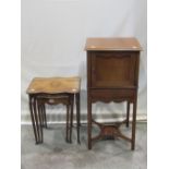 A 19th century mahogany bedside cupboard enclosed by a panelled door over a drawer on square cut