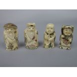Four late Meiji period carved ivory netsukes of figures of standing gentleman, the largest 6.5cm