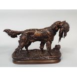 Good cast bronze study of a retriever with a pheasant in his mouth, upon a naturalistic oval base,