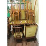 An art nouveau parlour room suite comprising set of five chairs with carved stick backs and high