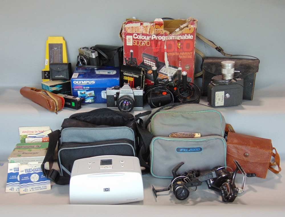 A large collection of various vintage cameras and optical equipment together with a Grandstand video