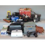 A large collection of various vintage cameras and optical equipment together with a Grandstand video