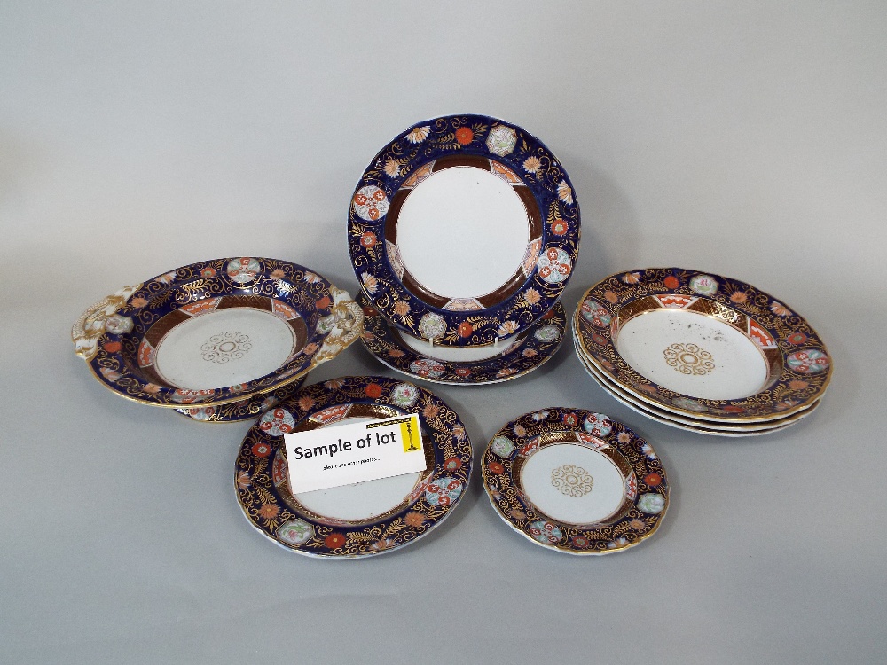 A collection of early 19th century ironstone china dinner wares with printed and infilled border