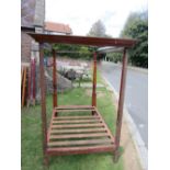 A 19th century mahogany and stained pine framed four poster bedstead, the front posts with turned