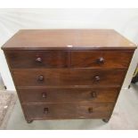 A 19th century mahogany bedroom chest of two short over three long drawers raised on squat ring