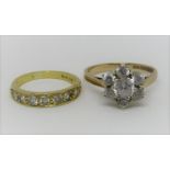 18ct seven stone ring, size J and a 9ct flower head ring, both set with white stones, size O, 6.2g