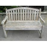A Royal Arrow weathered contemporary plantation teak two seat garden bench with slatted seat and